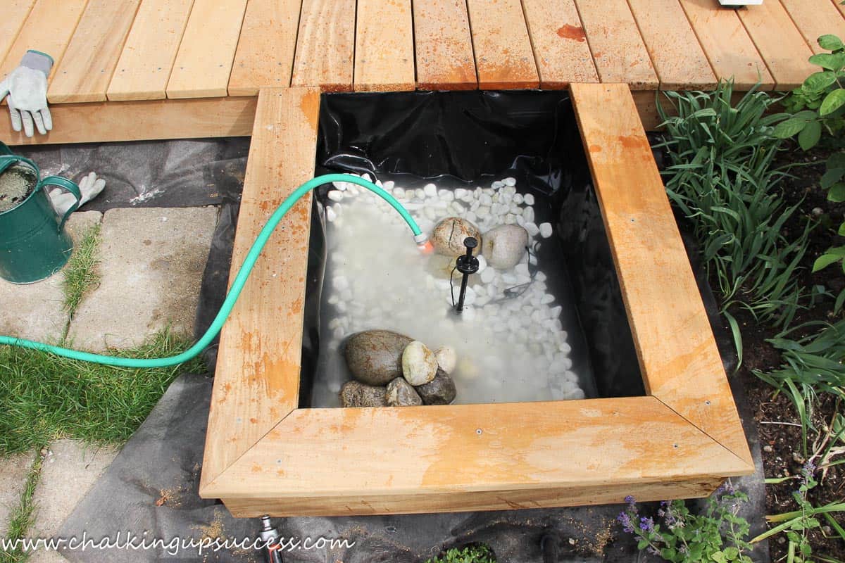 DIY above-ground-pond from ChalkingUpSuccess.com Filling an above-ground with water.